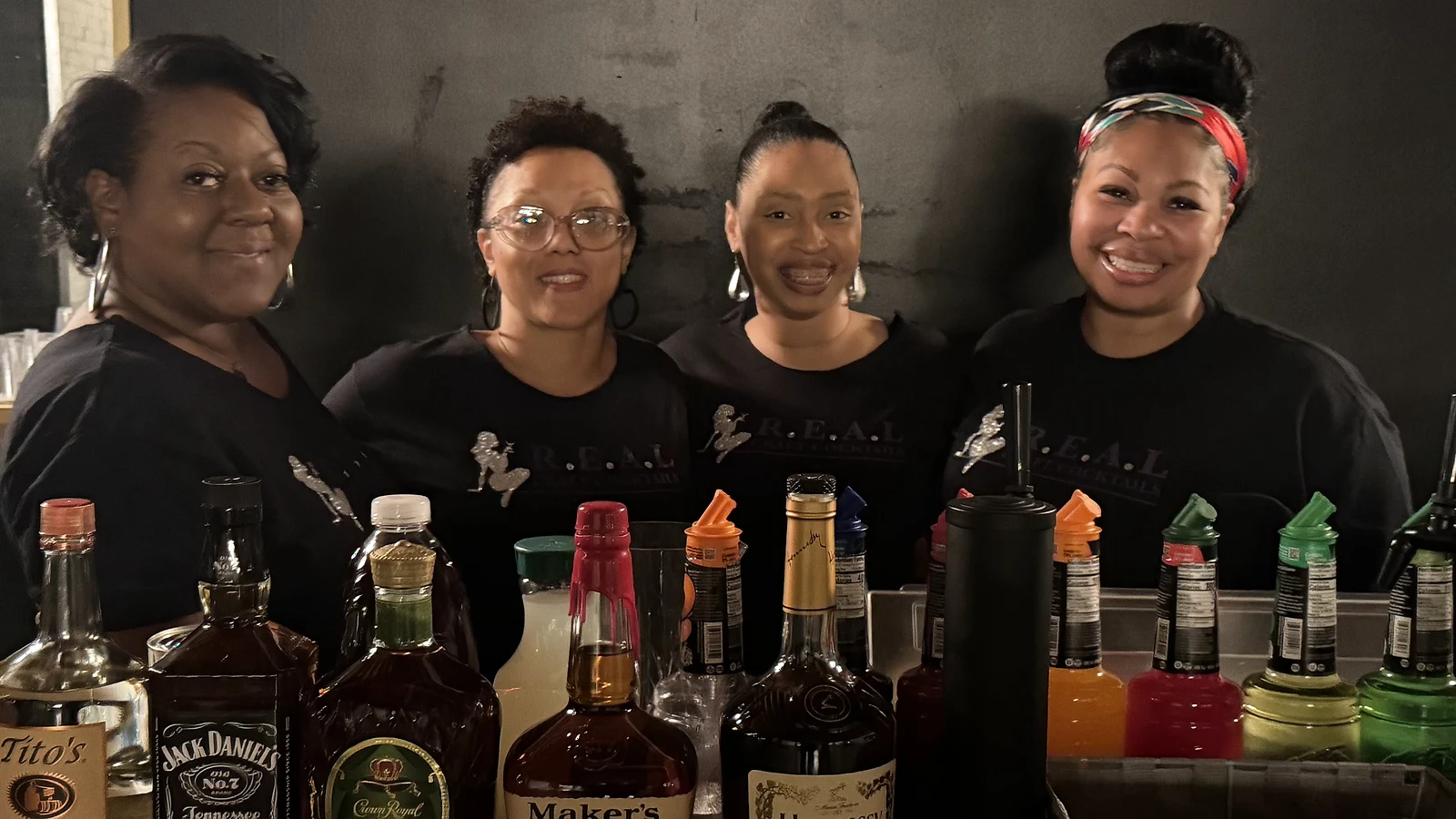 RCC team members standing behind a stocked mobile bar
